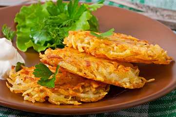 Fragrant potato pancakes with sour cream and herbs