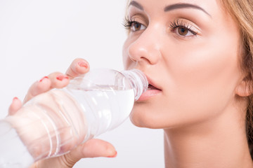 Healthy young sportswoman does the exercises