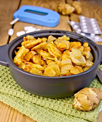 Jerusalem artichokes roasted in pan with meter and pills