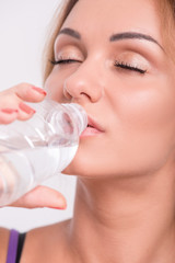 Healthy young sportswoman does the exercises