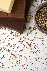 white brown and dark chocolate bar