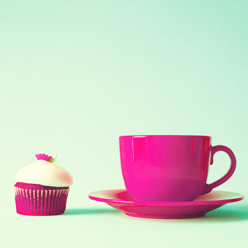 Vintage red cupcake with red tea cup
