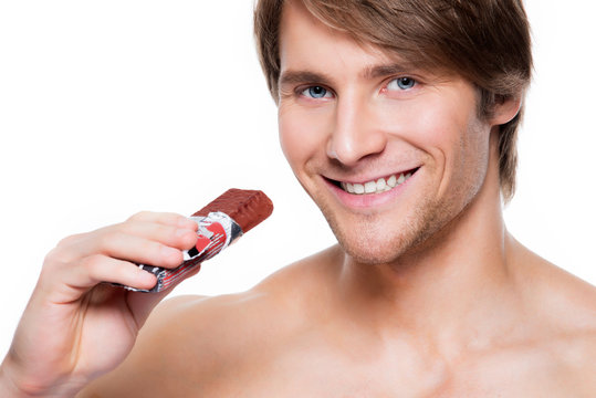 Handsome Smiling Man With Chocolate Bar.