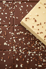 white brown and dark chocolate bar