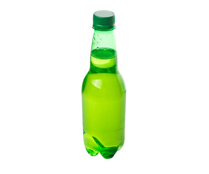 Green colored soda drinks in bottles over white background 