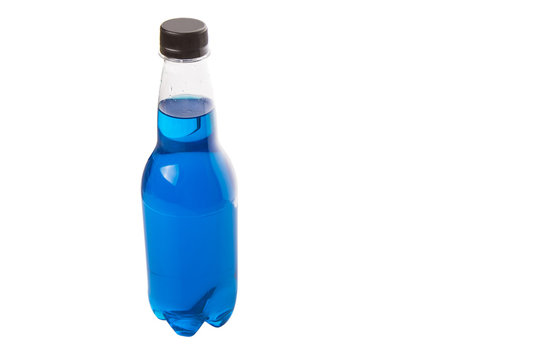 Blue colored soda drinks in bottles over white background 