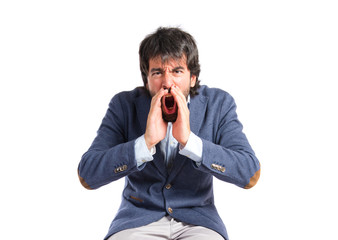 Businessman shouting over isolated white background