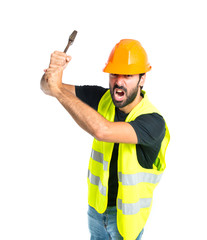 workman with wrench over white background