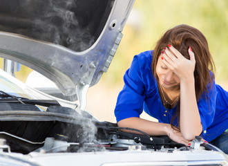 girl with a broken car