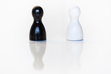 Black and white toy figurine, diversity concept