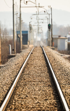 Railroad tracks go to horizon