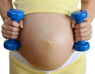 Pregnant woman and dumbells