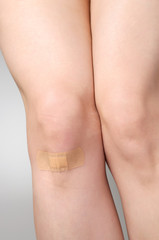 Plaster on female leg