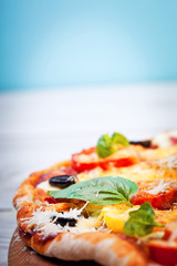 Delicious fresh pizza served on wooden table - 72004539