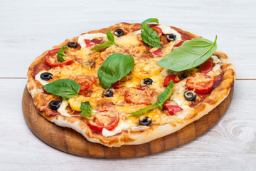 Delicious fresh pizza served on wooden table