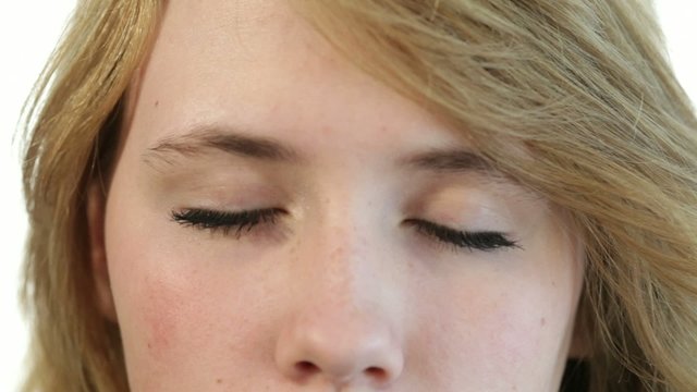 Closeup portrait to the head of a teenager girl, closed eyes, op