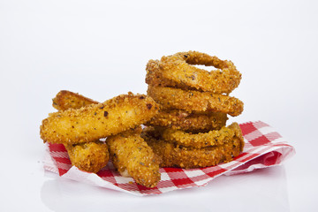 Fried onion rings and parmesan cheese sticks. Fast food