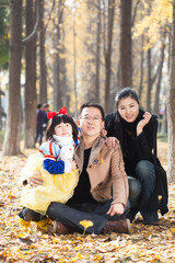 Naklejka na ściany i meble happy family togetherness portrait in forest, father,mother and