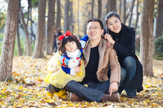 happy family togetherness portrait in forest, father,mother and