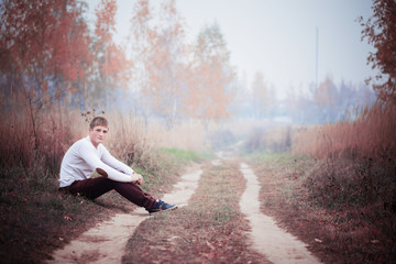 Fototapeta premium young men in autumn park