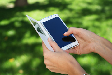 Close up of a man using mobile smart phone