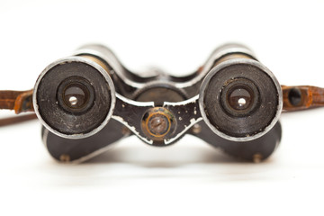 Old Vintage binoculars isolated on white background