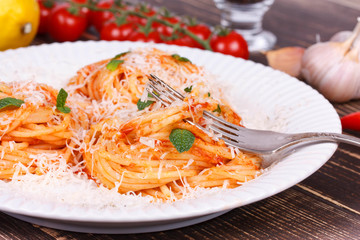 Italian pasta with tomato sauce, cheese and mint