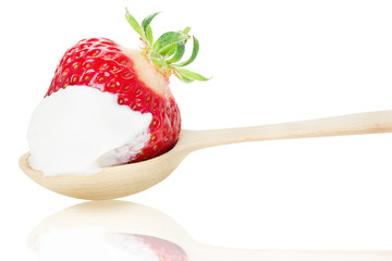 strawberry with cream  on the wooden spoon