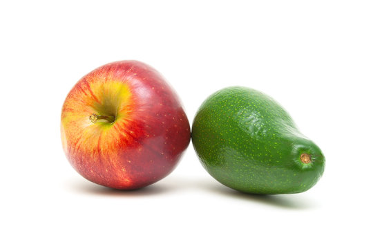 apple and avocado isolated on white background close-up