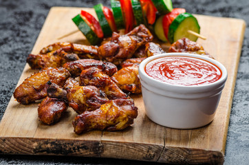 Sticky chicken with red hot dip