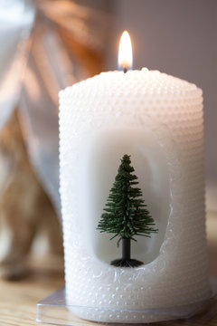 Christmas decoration - white candle with Christmas tree