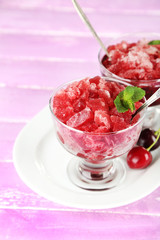 Closeup of cherry granita in glass bowls,