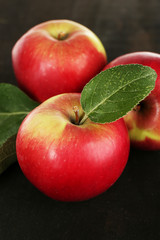 Ripe apples on wooden background
