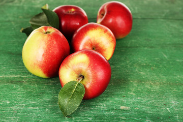 Ripe apples on wooden background