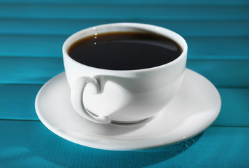 Cup of coffee on wooden table
