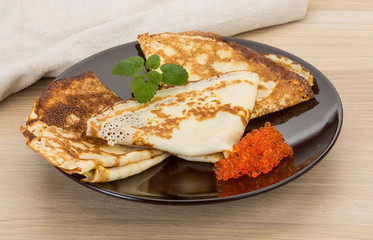 Pancakes with red caviar