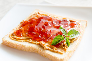 Sandwich with peanut butter and strawberry jelly
