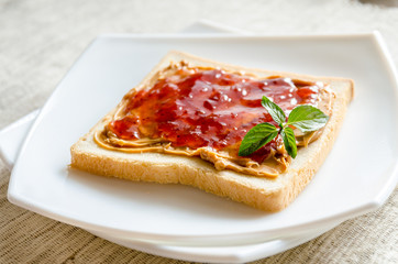 Sandwich with peanut butter and strawberry jelly