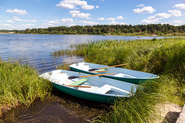Fototapeta na wymiar Two plastic boat at the lake in summer day
