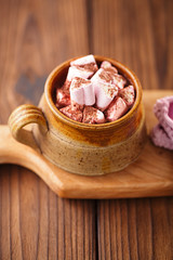 hot chocolat vintage mug, topping with marshmallow on textured w