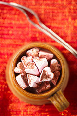 hot chocolat vintage mug on red glitter backdrop