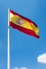 Spanish flag with a cloud on the sky