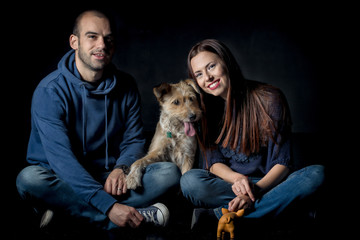 portrait of couple and their cute dog