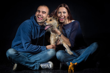 Obraz premium portrait of couple and their cute dog