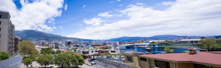 Fototapeta na wymiar rooftops with Pichincha volcano in the background of Quito