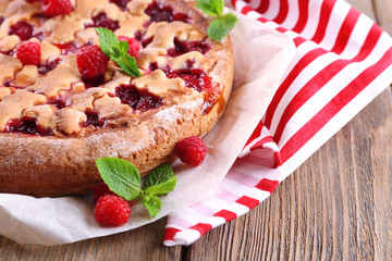 Tasty cake with berries on table close-up