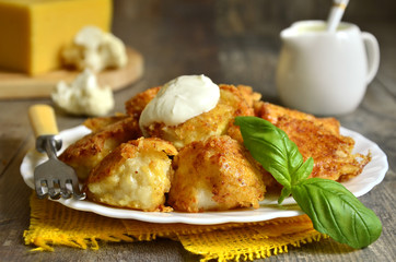 Fried cauliflower in cheese crisp.