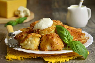 Fried cauliflower in cheese crisp.