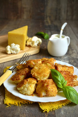 Fried cauliflower in cheese crisp.