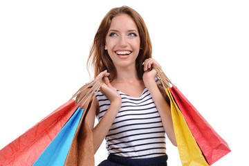 Beautiful young woman with shopping bags isolated on white